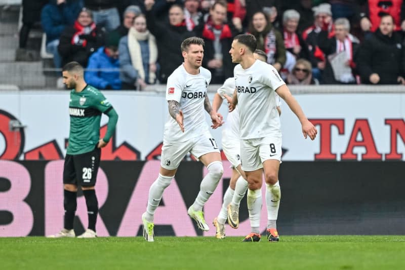 Freiburg's Lukas Kuebler (L) and Freiburg's Maximilian Eggestein celebrate their goal during the German Bundesliga soccer match between SC Freiburg and VfB Stuttgart at the Europa-Park Stadium. Harry Langer/dpa