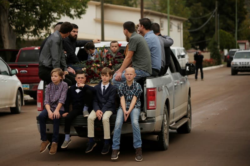 Relatives of Christina Marie Langford Johnson, who was killed by unknown assailants, accompany her coffin during the funeral service, before a burial at the cemetery in LeBaron, Chihuahua