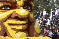 People look at the Snapchat float at the 134th Rose Parade in Pasadena, Calif., Monday, Jan. 2, 2023. (AP Photo/Michael Owen Baker)