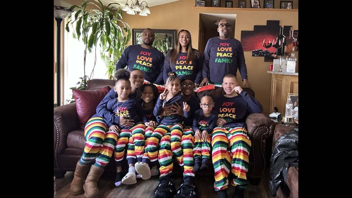 Claude Hodges Jr. (sitting center with neice on his lap) poses for a photo with his family during Christmas 2022. 