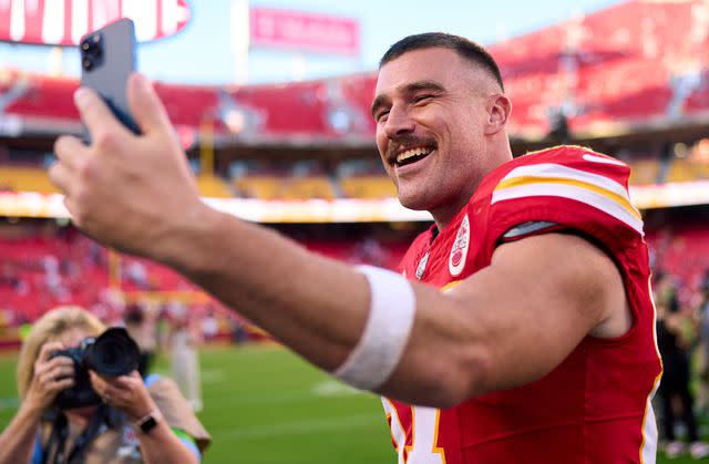 <p>Cooper Neill/Getty Images</p> Travis Kelce celebrates after a win over the Chicago Bears at Arrowhead Stadium on Sept. 24, 2023