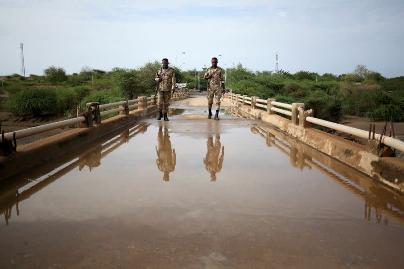 FILE PHOTO: Amhara Special Forces members stand guard on the Tekeze river bridge near Ethiopia-Eritrean border