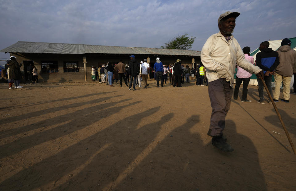 An elderly man arrives at a poling station in Maseru, Lesotho, Friday, Oct. 7, 2022. Voters across the picturesque mountain kingdom of Lesotho are heading to the polls Friday to elect a leader to find solutions to high unemployment and crime. (AP Photo/Themba Hadebe)