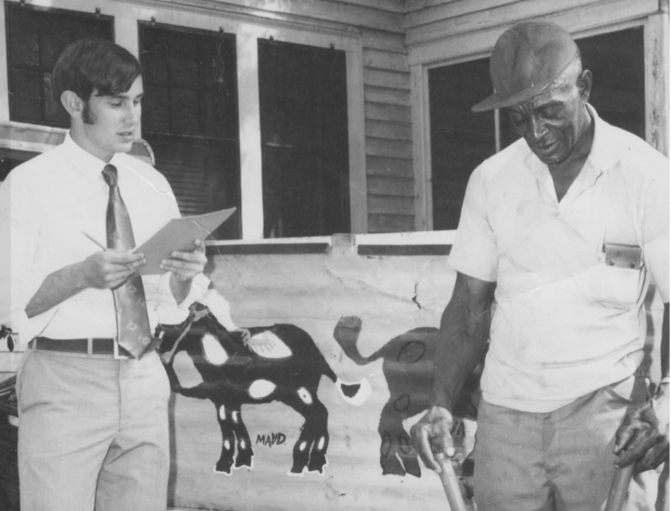 Philip Lee Williams, left, as a young journalist conducts an interview. He will speak Tuesday in Eatonton.