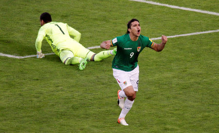 Football Soccer - Bolivia v Argentina - World Cup 2018 Qualifiers - Hernando Siles stadium, La Paz, Bolivia 28/3/17. Bolivia's Marcelo Martins celebrates next to Argentina's goalkeeper Sergio Romero after he scored a goal. REUTERS/Manuel Claure