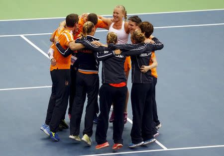 Members of the Netherlands team celebrate their victory over Russia in their Fed Cup World Group tennis match in Moscow February 7, 2016. REUTERS/Maxim Shemetov