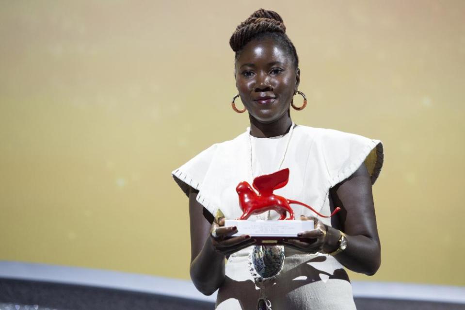 Alice Diop receives the Lion of the Future award for Saint Omer at the Venice film festival, September 2022.
