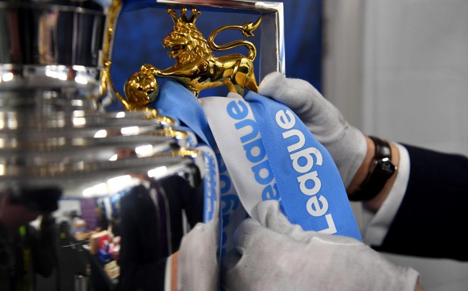 The Premier League trophy is prepared during the Premier League match between Brighton & Hove Albion and Manchester City - Getty Images/Michael Regan