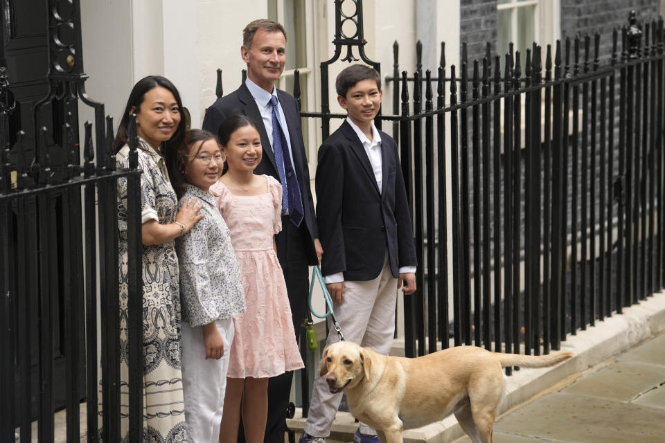 Outgoing Conservative chancellor of the exchequer Jeremy Hunt, with his wife Lucia Hunt and their children Jack, Anna and Eleanor leave 11 Downing Street after the Labour party won a landslide victory in the general election, Friday, July 5, 2024. Britain's Labour Party swept to power Friday after more than a decade in opposition, as a jaded electorate handed the party a landslide victory — but also a mammoth task of reinvigorating a stagnant economy and dispirited nation. (AP Photo/Vadim Ghirda)