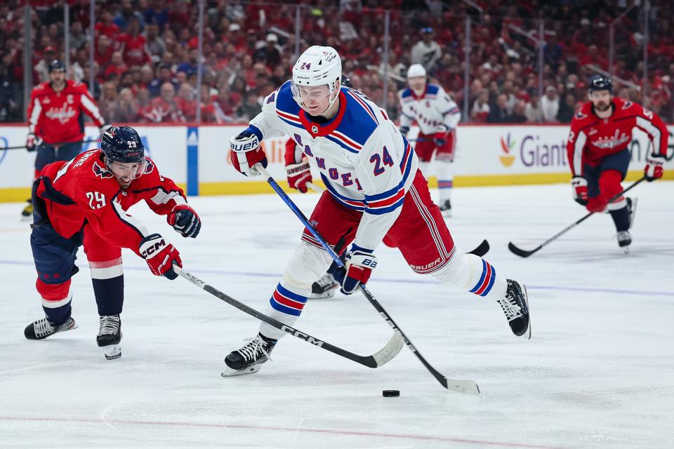 WASHINGTON, DC - APRIL 28: Kaapo Kakko #24 of the New York Rangers shoots the puck in front of Hendrix Lapierre #29 of the Washington Capitals during the first period in Game Four of the First Round of the 2024 Stanley Cup Playoffs at Capital One Arena on April 28, 2024 in Washington, DC.