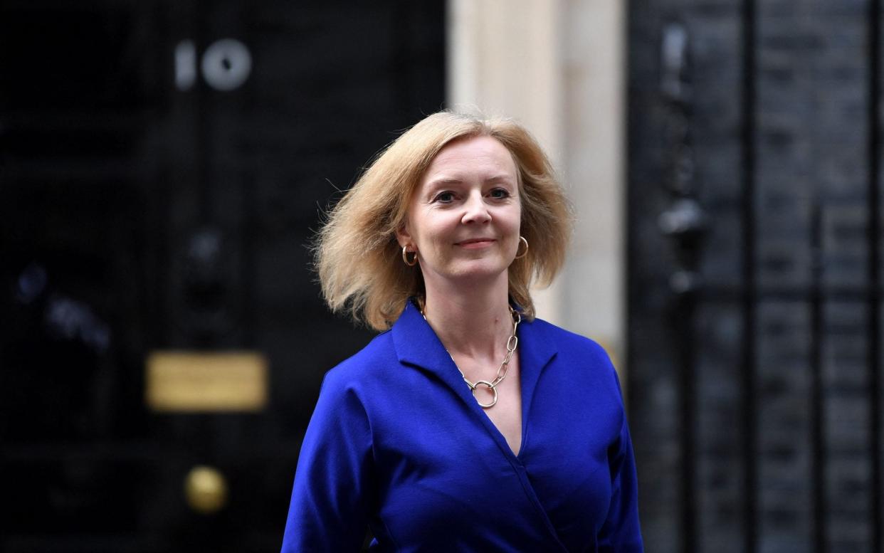 Liz Truss, the newly appointed Foreign Secretary, and the first Tory woman to hold the position, leaves 10 Downing Street on Wednesday