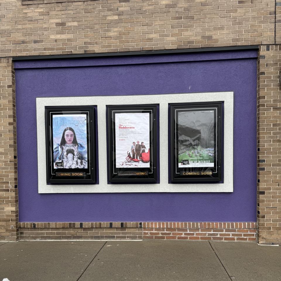 Posters for "Poor Things," "The Holdovers," and "The Zone of Interest" – all nominated for Best Picture – hang on the exterior wall of Cinema Capitol.