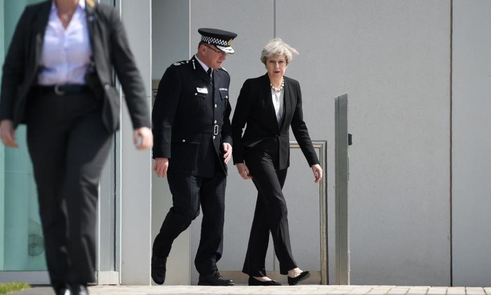 Theresa May walks with Greater Manchester police chief constable Ian Hopkins