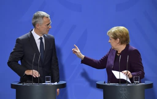 German Chancellor Angela Merkel (R) and NATO Secretary-General Jens Stoltenberg have taken issue with French President Emmanuel Macron's description of NATO as undergoing 'brain death'