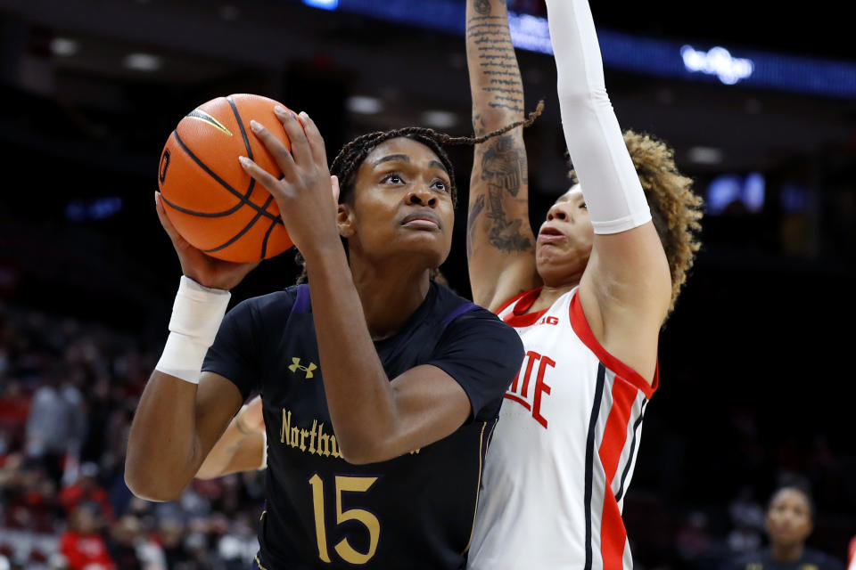 Northwestern forward Courtney Shaw (15) controls the ball as Ohio State guard Rikki Harris, right, defends during the first half of an NCAA college basketball game at Value City Arena in Columbus, Ohio, Thursday, Jan. 19, 2023. (AP Photo/Joe Maiorana)