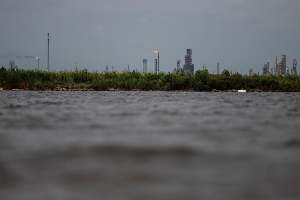 An oil and gas plant is seen across the Bayou Contraband as the water starts to rise before the arrival of Hurricane Laura in Lake Charles, Louisiana. (Photo: ANDREW CABALLERO-REYNOLDS via Getty Images)