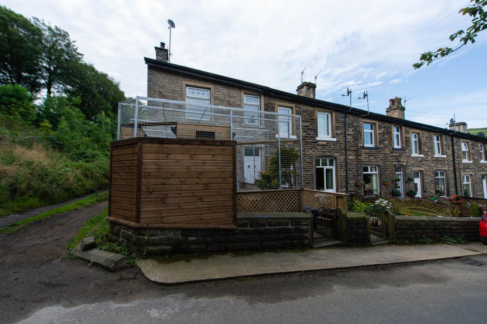 The cage sits at the end of a row of terraced houses in West Yorkshire (Picture: SWNS)