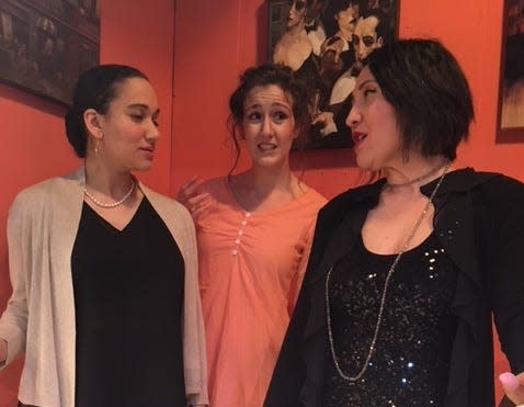 Tension mounts between leading ladies Samantha Walker as Betsy Reynolds (left) and Sandy Basile as Valerie Vickers (right) while Delaney Sump as Kitty (center) looks on in a scene from "Murder on the Rerun" at the Barnstable Comedy Club.