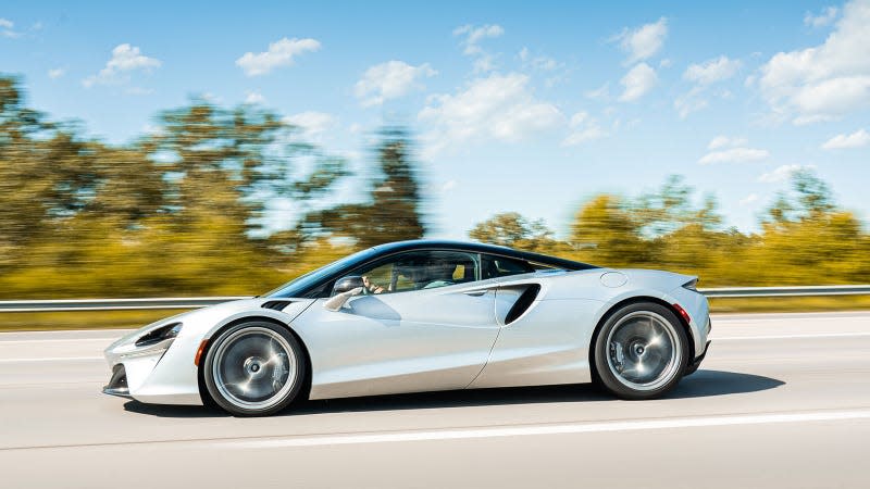 A photo of a silver McLaren Artura supercar. 