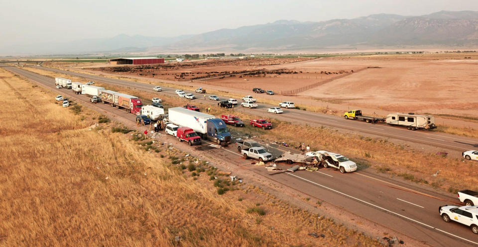 This photo provided by the Utah Highway Patrol and posted on the Utah Department of Public Safety website shows the scene of a fatal pileup, Sunday, July 25, 2021, on Interstate 15 in Millard County, near the town of Kanosh, Utah. (Utah Highway Patrol via AP)