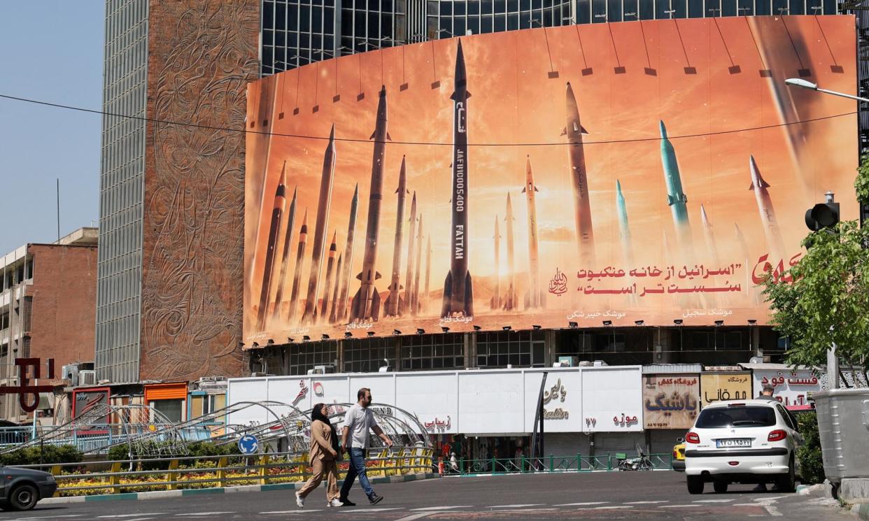 <span>An anti-Israel billboard with a picture of Iranian missiles is seen on a street in Tehran, Iran, on Friday.</span><span>Photograph: Majid Asgaripour/Reuters</span>