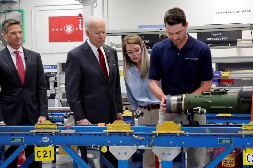 U.S. President Joe Biden and Lockheed Martin CEO Jim Taiclet speak with Javeline anti-tank missile assembly workers during a tour of a Lockheed Martin weapons factory in Troy, Alabama, U.S. May 3, 2022. REUTERS/Jonathan Ernst