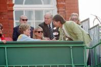 <p>Singer Cliff Richard joined Princess Diana in the royal box during the Stella Artois Championships in London. He looked appropriate for the summer event in a light green linen sport coat and patterned tie. </p>