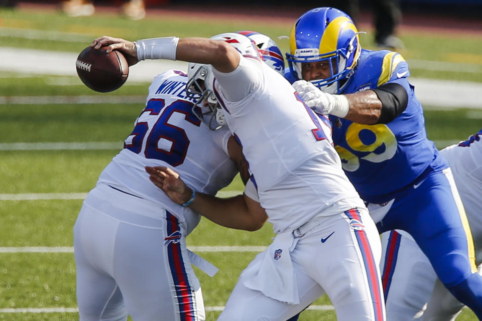 Los Angeles Rams' Aaron Donald (99) sacks Buffalo Bills' Josh Allen (17) during the second half of an NFL football game Sunday, Sept. 27, 2020, in Orchard Park, N.Y. (AP Photo/John Munson)