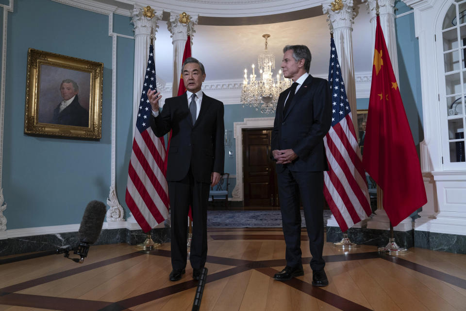 Secretary of State Antony Blinken accompanied by People's Republic of China Foreign Minister Wang Yi talk to reporters after a bilateral meeting at the State Department in Washington, Thursday, Oct. 26, 2023. (AP Photo/Jose Luis Magana)