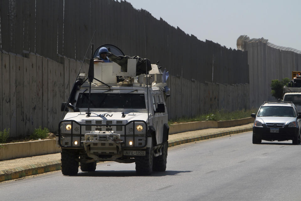 Spanish U.N peacekeepers patrol the Lebanese side of the Lebanese-Israeli border in the southern village of Kfar Kila, Lebanon, Monday, Aug. 26, 2019. Lebanon's state-run National News Agency said Monday that Israel's air force attacked a Palestinian base in the country's east near the border with Syria. Lebanese President Michel Aoun told the U.N. Special Coordinator for Lebanon, Jan Kubis, that the attacks violate a U.N. Security Council resolution that ended the 2006 war between Israel and Hezbollah. (AP Photo/Mohammed Zaatari)