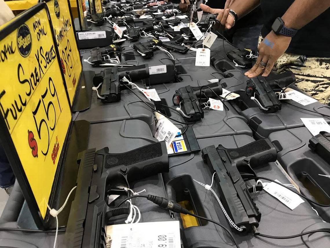 A table of firearms at the Florida Gun Show in Tampa, Fla. (Zachary T. Sampson/Tampa Bay Times/TNS)