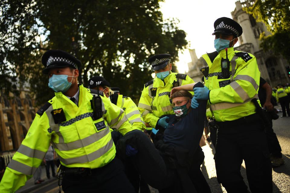 LONDON, ENGLAND - SEPTEMBER 01: Police officers detain protestors as Extinction Rebellion demonstrate in Westminster on September 1, 2020 in London, England. The environmental activist group organised several events across the UK timed for the return of government officials from the summer holiday. (Photo by Peter Summers/Getty Images)