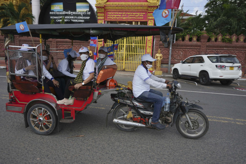 Cambodian People's Party (CPP) supporters participate in a rally during the last day of campaigning ahead of the June 5 communal elections, in Phnom Penh, Cambodia, Friday, June 3, 2022. (AP Photo/Heng Sinith)