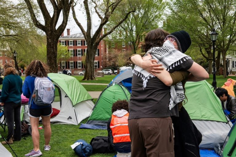 Pro-Palestinian students embrace each other as they take down their encampment after reaching a deal with Brown University in Providence, Rhode Island (Joseph Prezioso)