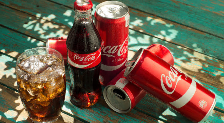 coca-cola bottles and cans. coke is a blue-chip stocks