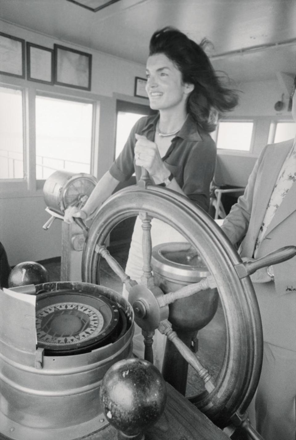 <p>Jacqueline Kennedy Onassis behind the wheel of the Staten Island Ferry on its voyage back to Manhattan in 1976. </p>