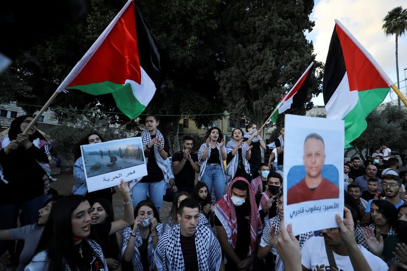 FILE PHOTO: People take part in a protest as they support the six Palestinian militants men who had escaped from Gilboa prison earlier this week in Nazareth