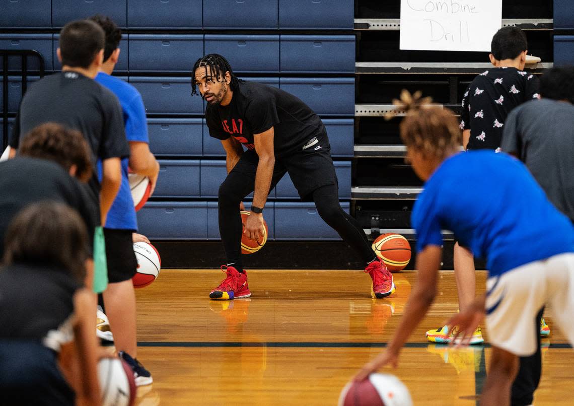 Modesto native and NBA player Gabe Vincent leads a ball handling drill during the Modesto Slam N Jam basketball camp at Big Valley Christian in Modesto, Calif., on Tuesday, July 6, 2022.