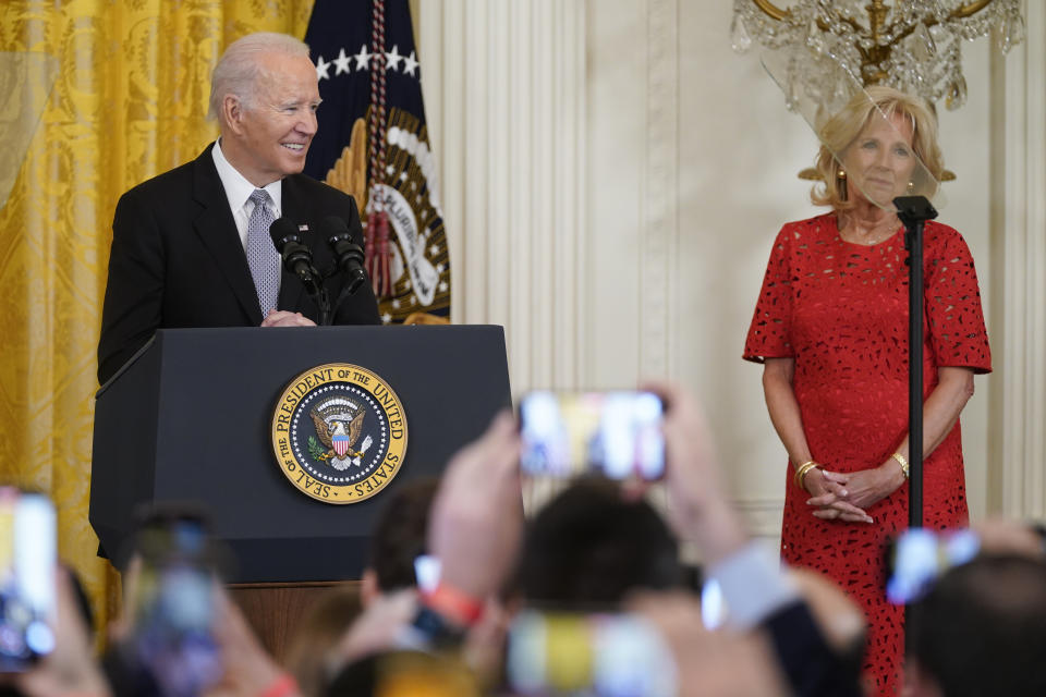 President Joe Biden, accompanied by first lady Jill Biden, speaks during a Nowruz celebration in the East Room of the White House, Monday, March 20, 2023, in Washington. (AP Photo/Evan Vucci)