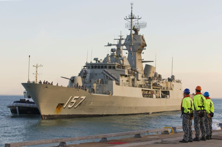 Royal Australian Navy boatswains mates from HMAS Larrakia (R) prepare for the arrival of HMAS Perth on July 2, 2015 as it arrives in the Port of Darwin in preparation for the commencement of Exercise Talisman Sabre 2015