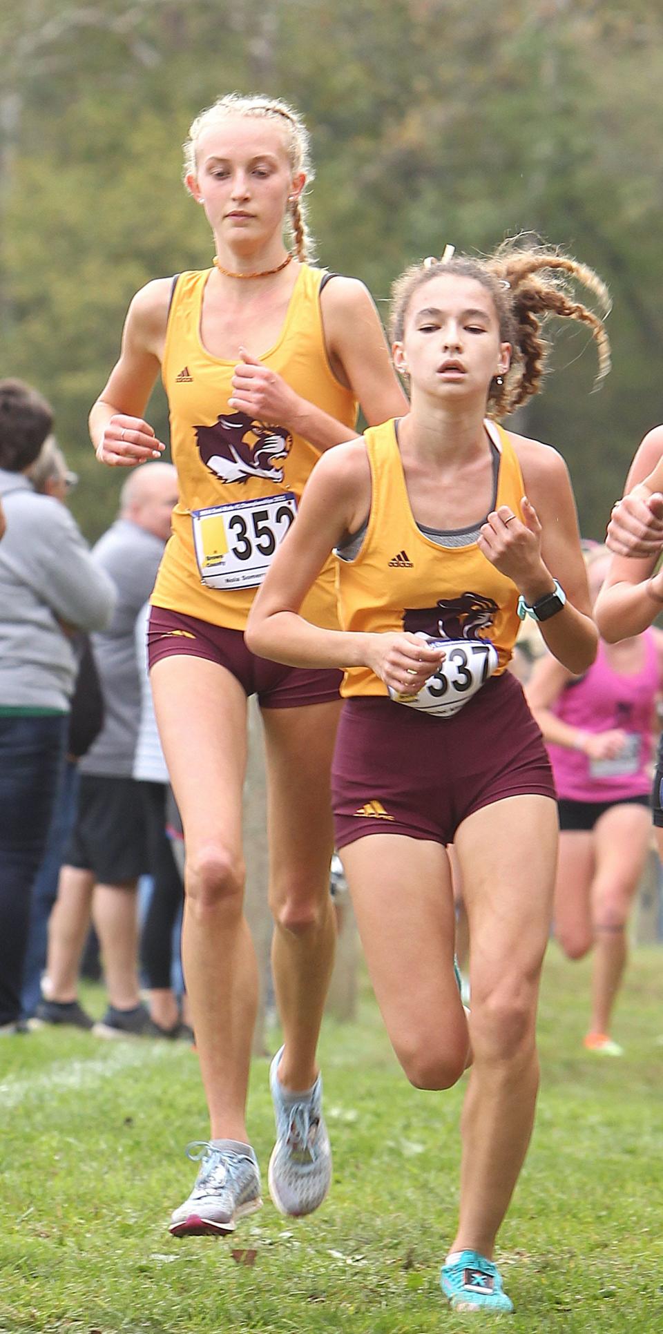 Bloomington North's Rachel Allison (337) and Nola Sommers Glenn (352) compete in the Brown County cross country semi-state meet on Saturday, Oct. 23, 2021.