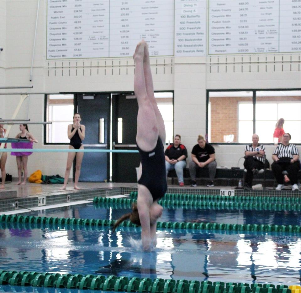 Autumn Zumpf of Pueblo Central enters the water on her dive during the South-Central League finals held at Pueblo County High School on Feb. 4, 2023.
