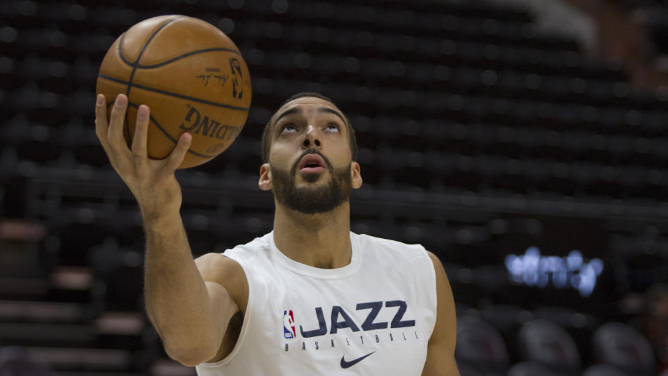 Rudy Gobert #27 of the Utah Jazz tosses a layup during warm ups before a game against the Miami Heat the at the Vivint Smart Home Arena on February 12, 2020 in Salt Lake City. (Photo by Chris Gardner/Getty Images)