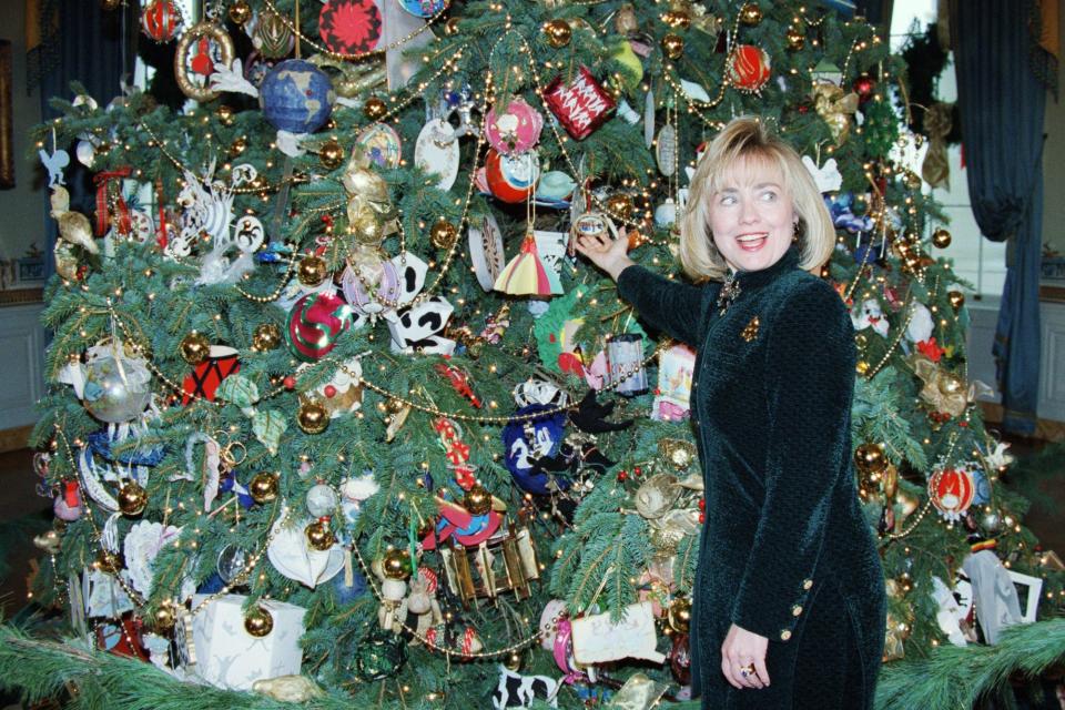 Hillary Clinton shows off ornaments on the White House Christmas tree in 1994.