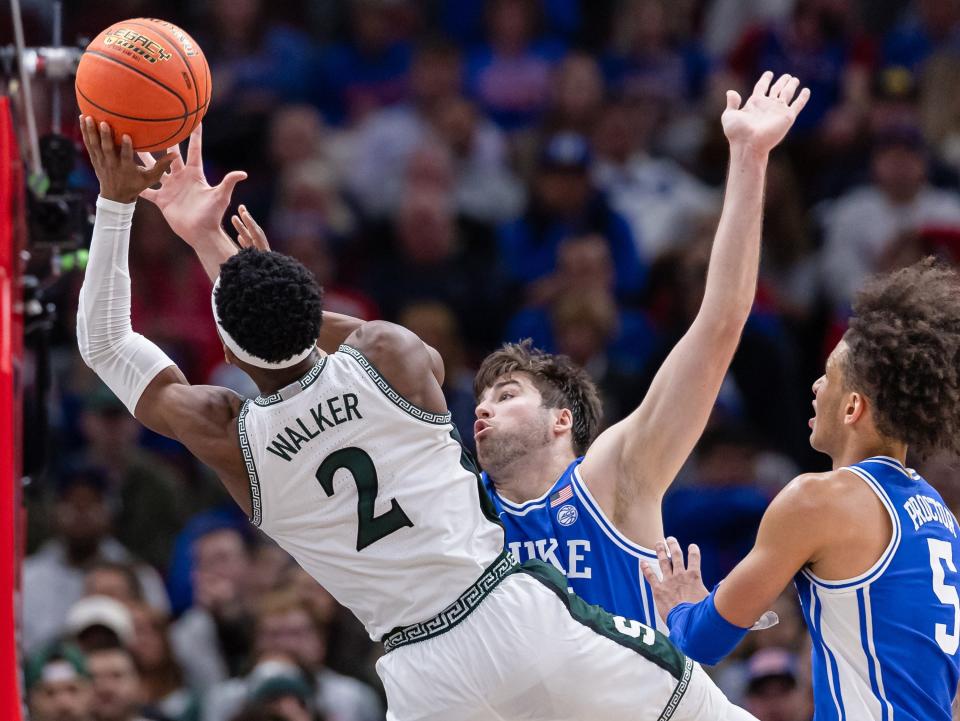 Tyson Walker of the Michigan State Spartans shoots the ball against Ryan Young of the Duke Blue Devils during the second half in the 2023 State Farm Champions Classic at the United Center on November 14, 2023 in Chicago, Illinois.