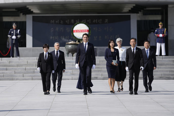 Canadian Prime Minister Justin Trudeau, center, leaves the National Cemetery in Seoul, South Korea, Wednesday, May 17, 2023. (AP Photo/Lee Jin-man, Pool)