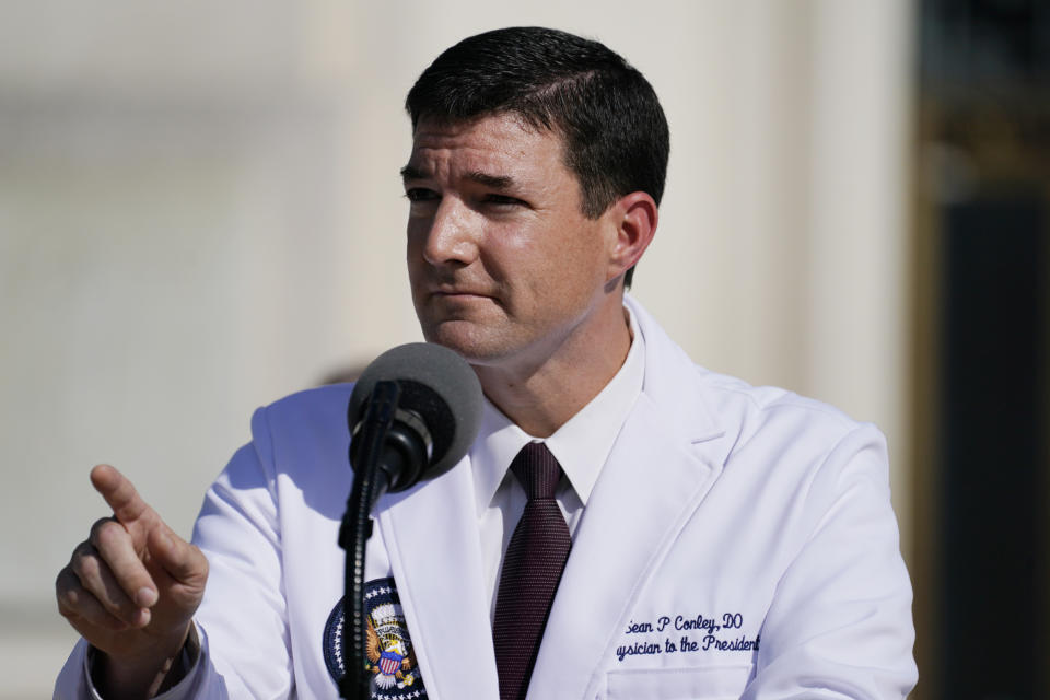 Dr. Sean Conley, physician to President Donald Trump, talks with reporters at Walter Reed National Military Medical Center, Monday, Oct. 5, 2020, in Bethesda, Md. (AP Photo/Evan Vucci)