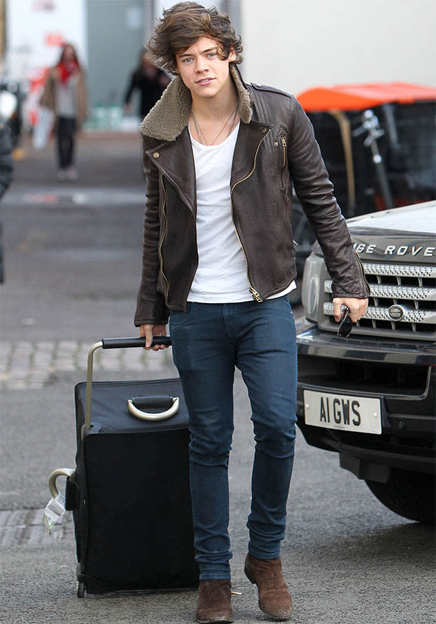 Harry's famously dishevelled locks are on display as he leaves the studio in a cool leather jacket, jeans and smart suede boots.