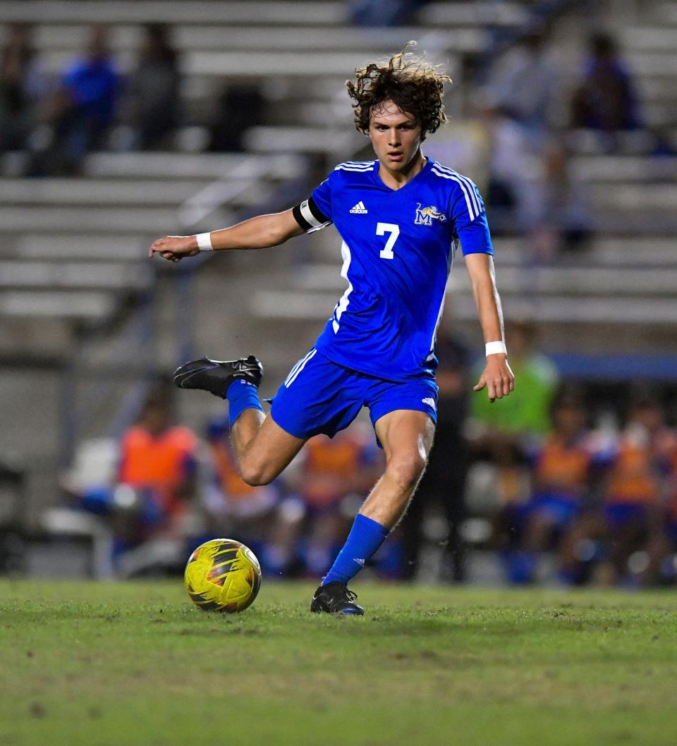 Martin County’s Vincent Bajis (7) kicks the ball up the field in a high school soccer game against Port St. Lucie on Tuesday, Dec. 12,2023, in Stuart.