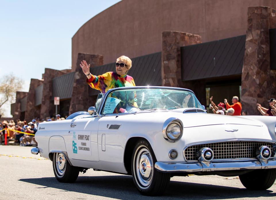 Former Palm Springs city councilmember Ginny Foat waves to spectators from a 1956 Ford Thunderbird during a parade Saturday to celebrate the city's 85th birthday.